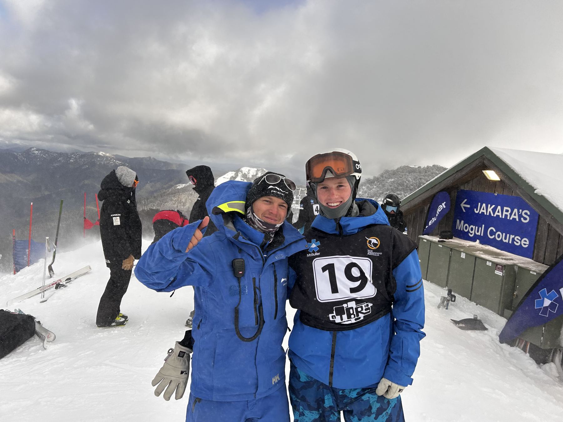 Hugh in race bib 19 with his coach, British Olympian Will Feneley